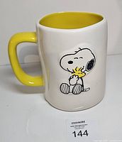 Front view showing Snoopy hugging Woodstock on mug