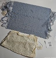Blue mesh crystal fabric and ivory crystal fabric displayed together