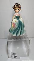 Front view of ceramic belle figurine