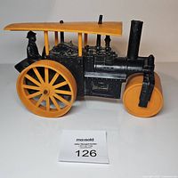 Side view showing full profile of road roller