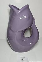 Front view of violet GurglePot fish pitcher