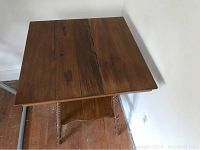 Top view of wooden side table showing wood plank surface with a split down the center.
