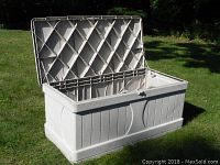 Suncast deck box model DB9000 with lid open on grass