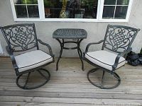 Full view of two chairs and table on deck