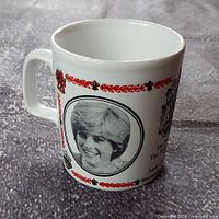 Mug front showing Lady Diana Spencer portrait with red decorative border