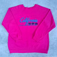 Full front view of hot pink California graphic sweatshirt