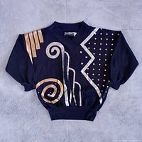 Front view of sweater showing full abstract geometric design