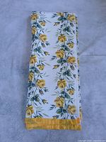 Blanket folded showing full floral pattern and trim