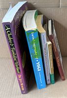 Side view of five paperback books