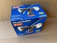 Box front showing Heath Zenith branding and image of dual-head security light