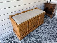 Front angled view showing full bench, upholstery, wood finish
