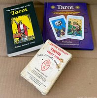 Front view of all three items: two tarot books and Thoth deck box