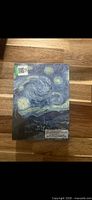Front of sealed notecard box showing Starry Night artwork and title
