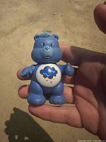 Front of Grumpy Bear showing belly badge and wear