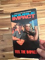 Front of Double Impact VHS slipcase
