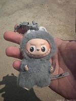 Front view showing vinyl face, fuzzy body, key ring loop