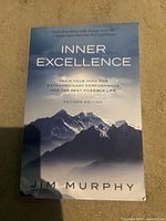 Front cover of paperback showing title, author, revised edition