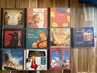 Front view of 12 soundtrack CDs in jewel cases
