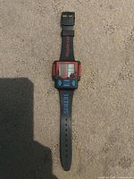 Front view showing watch face, strap with Nintendo and Tetris logos