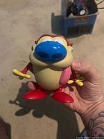 Front view Stimpy vinyl figure showing colors and bobblehead
