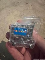 Front view of sealed miniature shopping cart showing Toys “R” Us logo