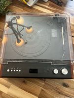 Top view showing platter, tonearm, controls and dust cover