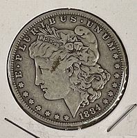 Obverse of 1884 Morgan Silver Dollar in holder