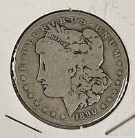 Obverse of 1890-O Morgan dollar showing Liberty head, date 1890