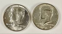 Obverse of both 1964 Kennedy half dollars side by side