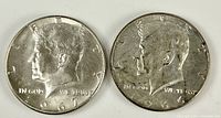 Obverse of 1967 and 1966 Kennedy half dollars showing dates and wear