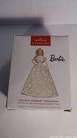 Front of Hallmark Keepsake box showing Barbie ornament image and branding