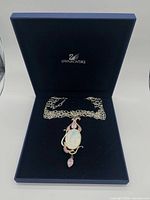 Necklace displayed inside open blue Swarovski box