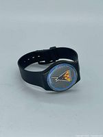 Full view of watch showing case, strap, geometric dial