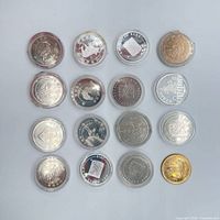 Group shot showing all 17 encapsulated coins