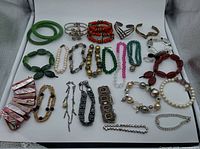 Overall view of entire grouping of bracelets in lot