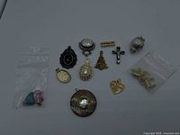Group view of all 14 charms, pendants, and components