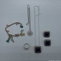 Group view of bracelet, necklaces, earrings and ring