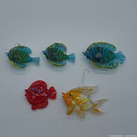 Group of five glass fish showing colour variety and hanging loops