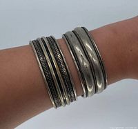 bracelets worn on wrist showing scale and design
