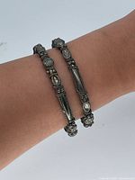 Bangles worn on wrist showing design and scale