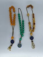 All three komboloi showing bead colors and disc fobs
