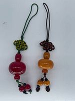 Both tassels side by side showing overall form and color