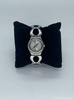 Front view of Swatch Irony Lady watch on cushion