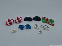 All seven pairs of earrings displayed together
