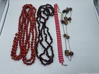 Group shot of all four jewellery pieces laid flat