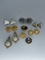 All 15 button covers laid out to show designs and finishes