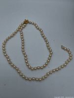 Full view of pearl necklace showing overall length and pearls