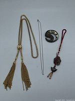 Overview of all four jewelry items laid out