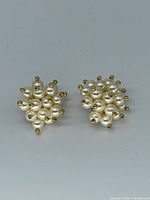 front view of both earrings showing clustered faux pearls with gold-tone tips