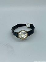 Front view of Moulin wristwatch showing dial and strap